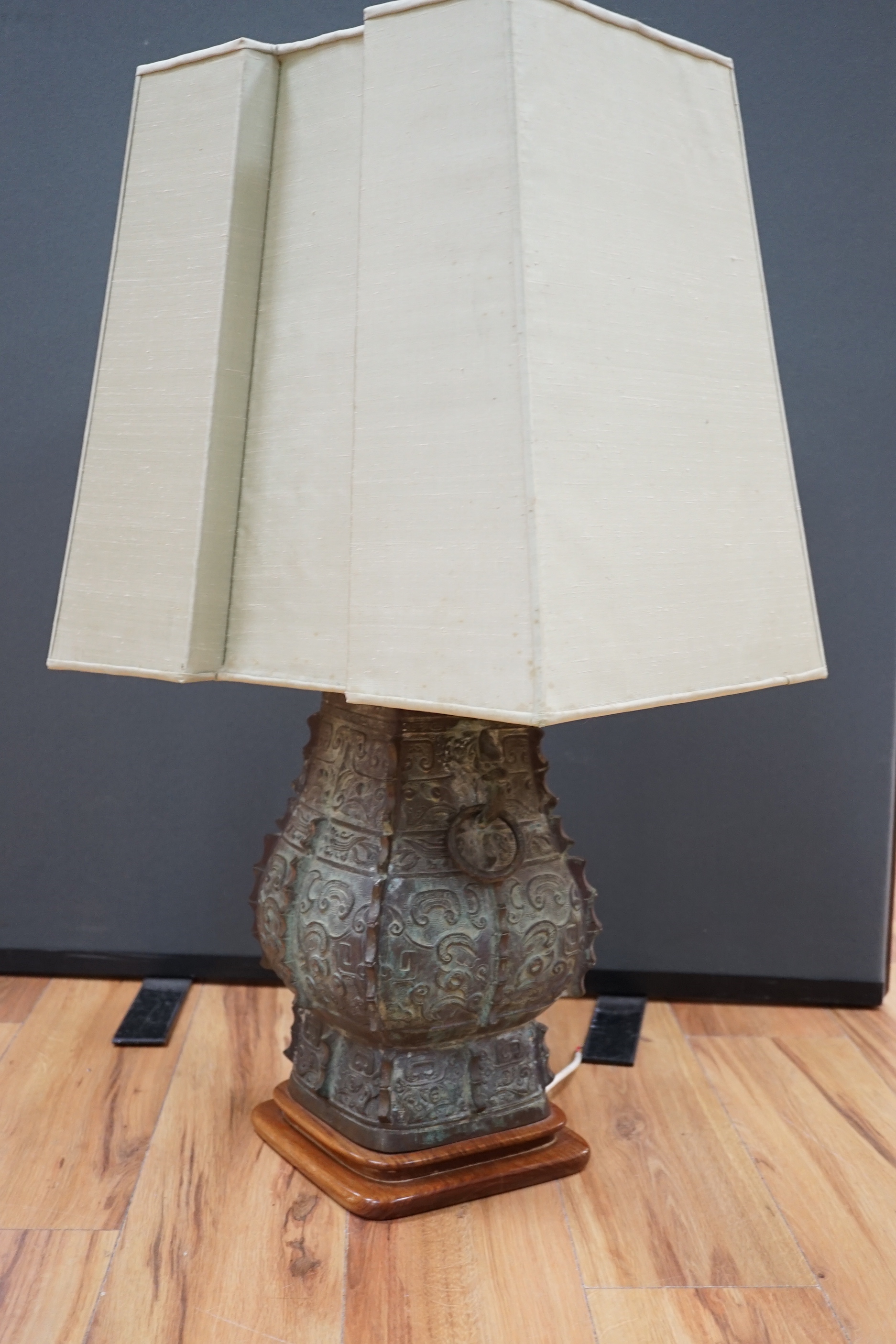 A Chinese archaistic bronze ‘zun’ lamp base, 84cm high including shade